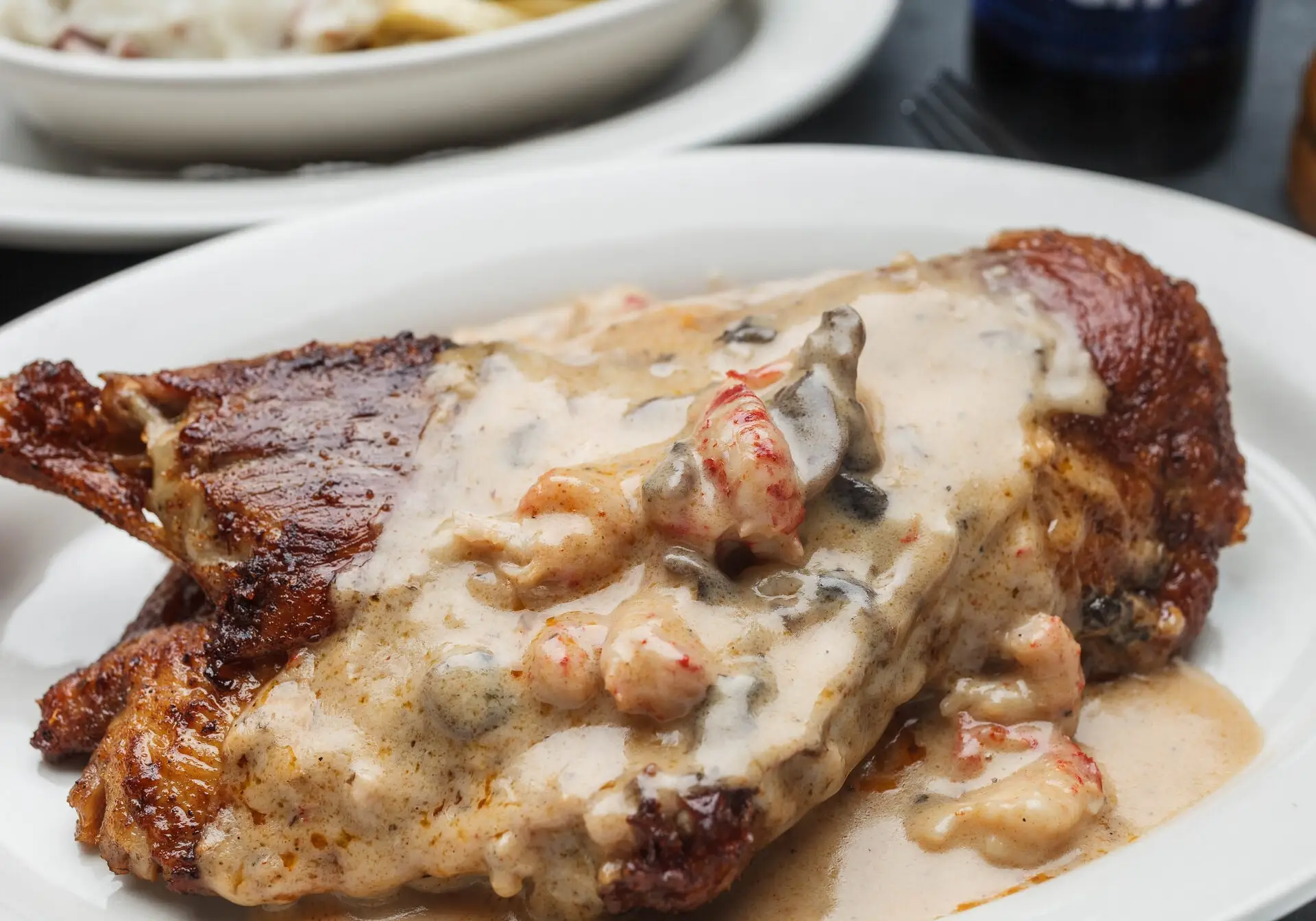 Blackened Bayou Duck topped with crawfish mushroom sauce