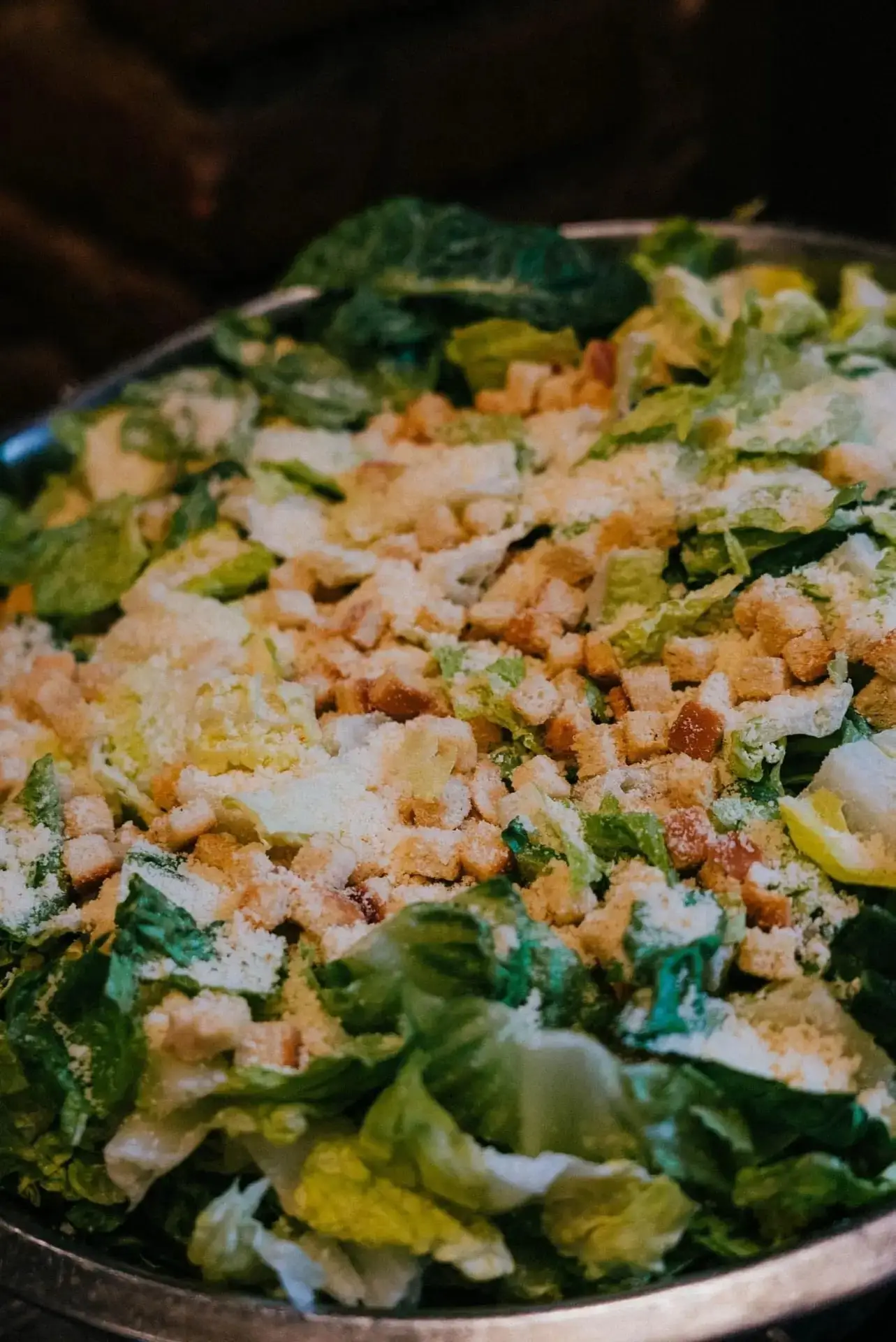 A catering pan of Caesar salad