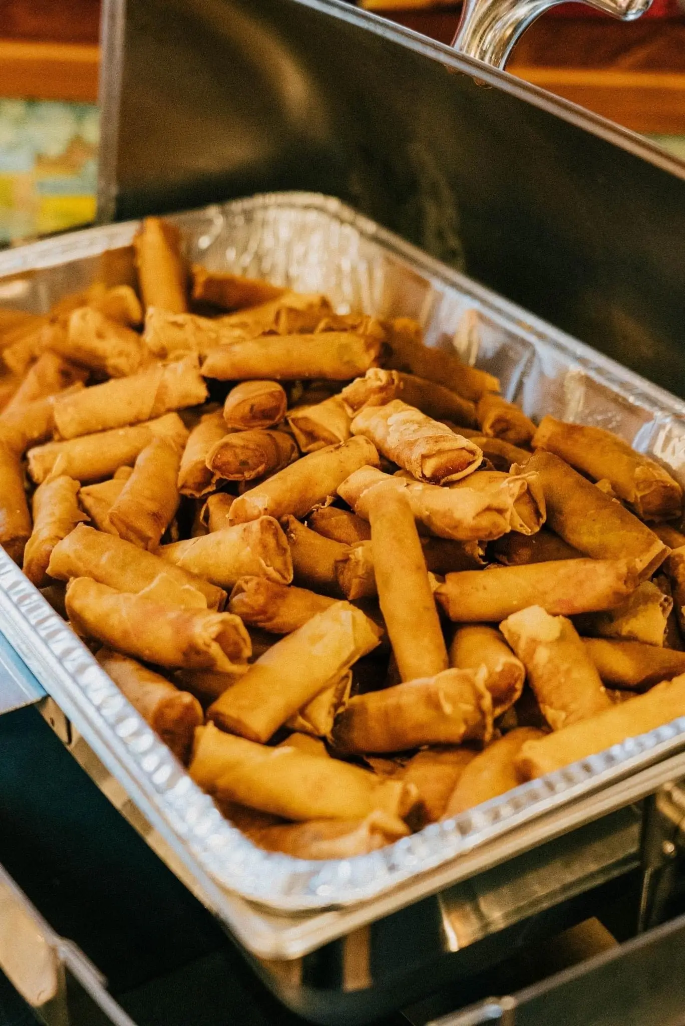 A catering pan of crispy eggrolls