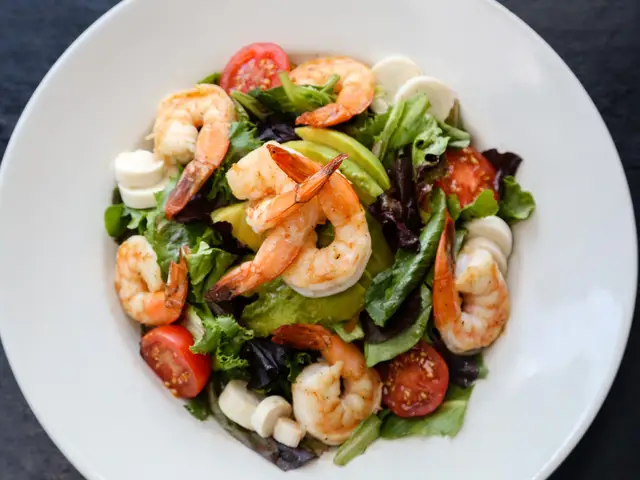 JoJo’s Salad: grilled Gulf shrimp, avocado, tomatoes and hearts of palm on mixed greens