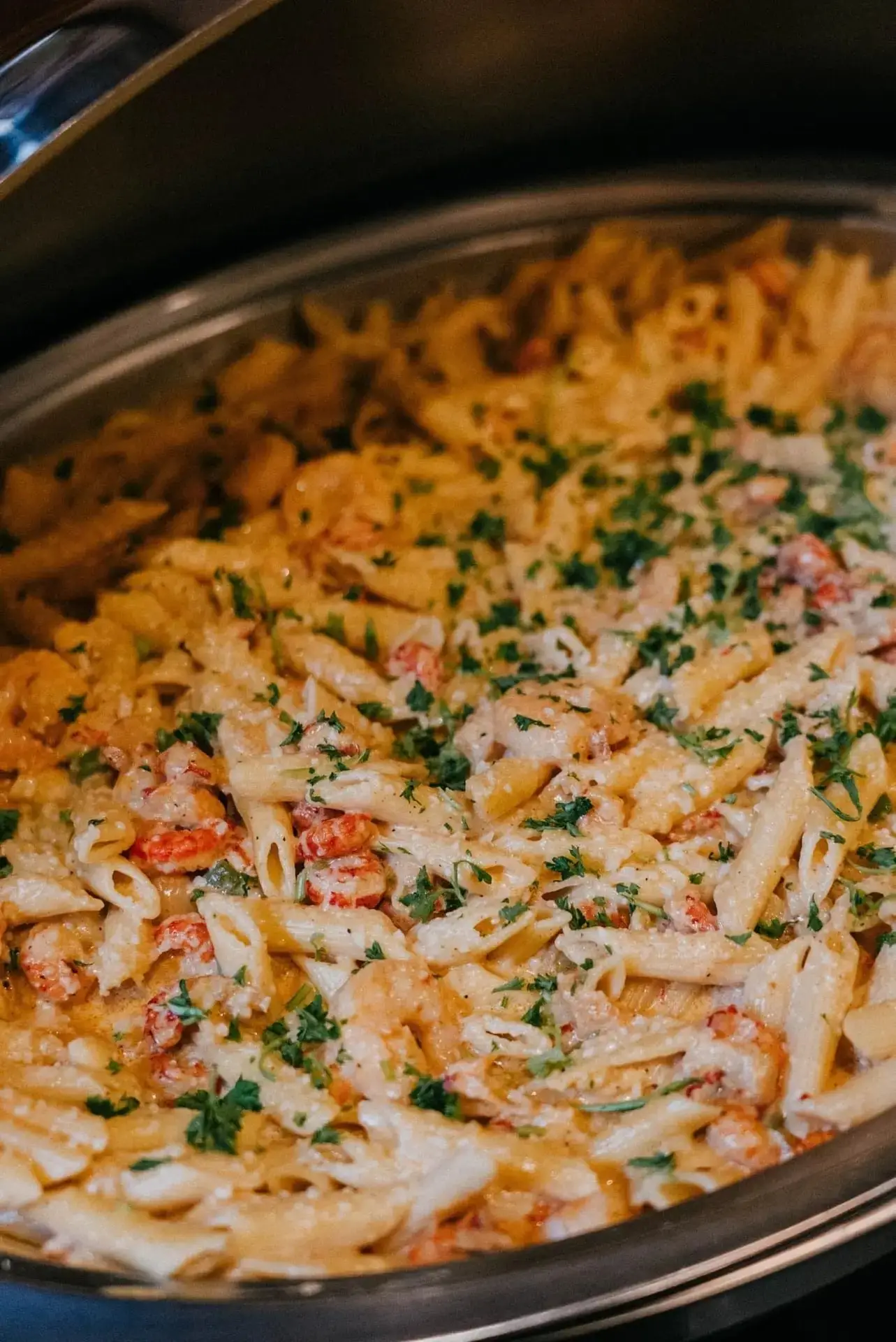 A catering pan of Mardi Gras Pasta with shrimp and crawfish